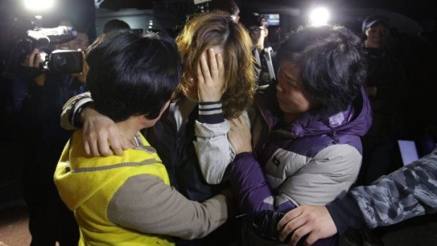 Relatives weep as they wait for missing passengers of the sunken ferry.