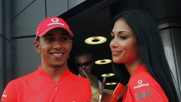 Lewis Hamilton  and his girlfriend Pussycat Dolls singer Nicole Scherzinger hold the trophy after his win ... "she is definitely a bit lucky for me".