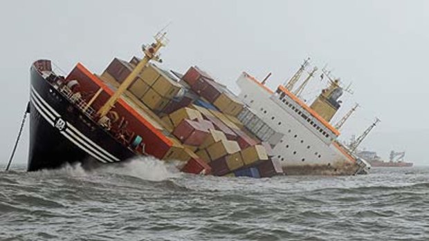 Containers fall from the deck of the damaged cargo ship MSC Chitrain in the Arabian Sea off the Mumbai coast.