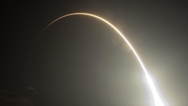 The Falcon 9 SpaceX rocket is seen during a time exsposure as it lifts off from space launch complex 40 at the Cape Canaveral Air Force Station