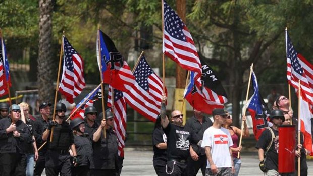 Members of the National Socialist Movement march to their rally near City Hall in Los Angeles,.