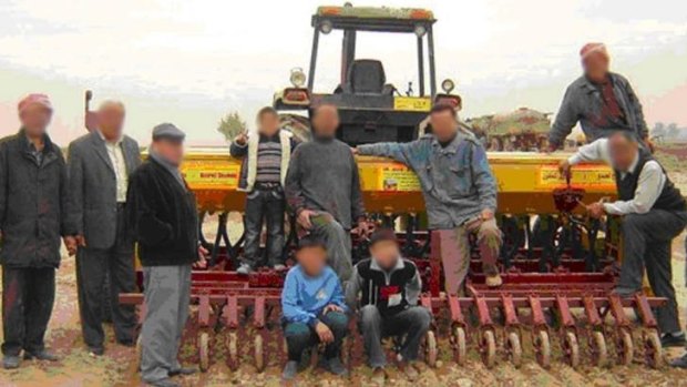 Under Islamic State control: Some of the Iraqi farmers involved in the project, pictured in 2009.