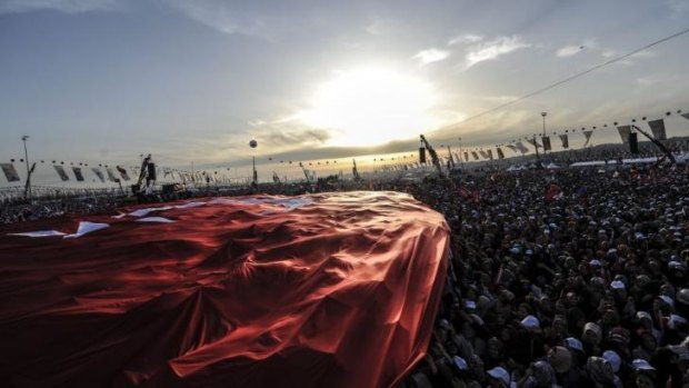 Supporters of Turkey's Prime Minister Recep Tayyip Erdogan attend an election rally in Istanbul.