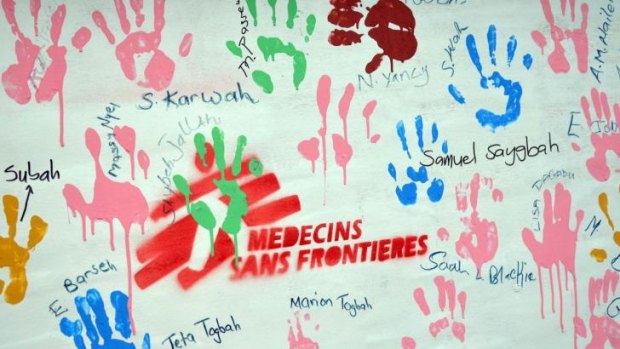 The hand prints and signatures of Ebola survivors on a board at the Medecins Sans Frontieres (Doctors Without Borders) treatment centre in the Liberian capital Monrovia.