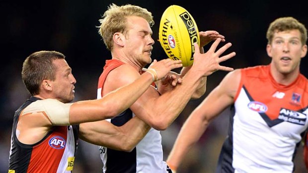 Front and centre: Demon Jack Watts marks despite Saint Jarryn Geary’s efforts to spoil during St Kilda’s 17-point win.
