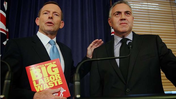 Reading matters: Opposition Leader Tony Abbott and shadow treasurer Joe Hockey with the Little Book of Big Labor Waste.