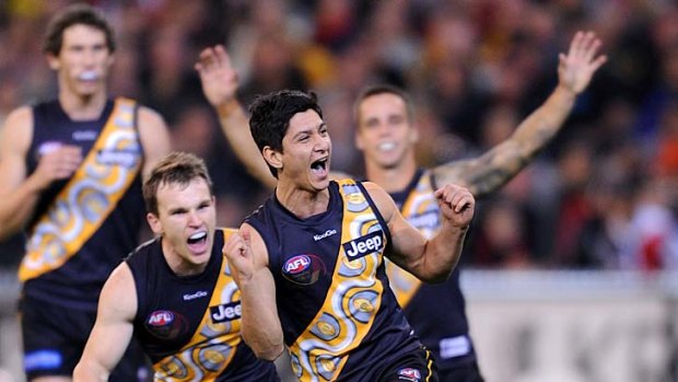 Robin Nahas leads celebrations in round nine as the pacy Tigers put the Bombers to the sword.