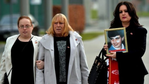 Donna Miller (right), whose brother Paul Carlile died in the 1989 Hillsborough disaster, holds a picture of him as she and Mary Corrigan (centre), whose son Keith McGrath was also killed, arrive to attend the opening day of the new inquests into the tragedy.