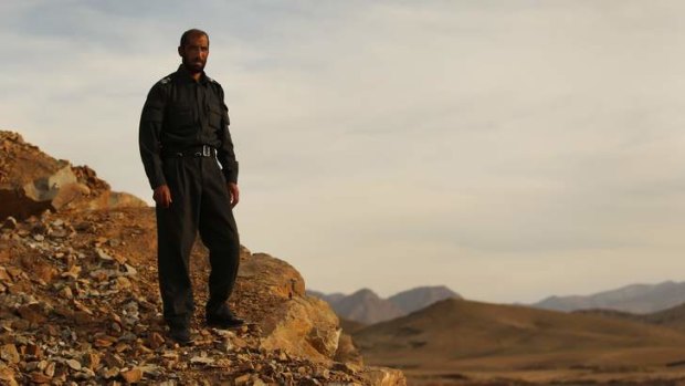 Master of all he surveys ... Matiullah Khan stands on a mountain ridge in Sagi, Tarin Kowt district.