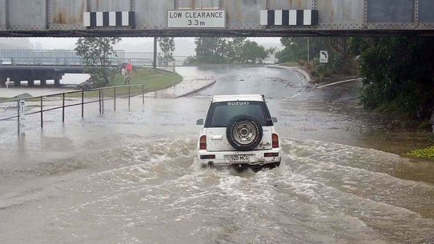 Flash flooding from rising storm water has closed roads all over the mid north coast.