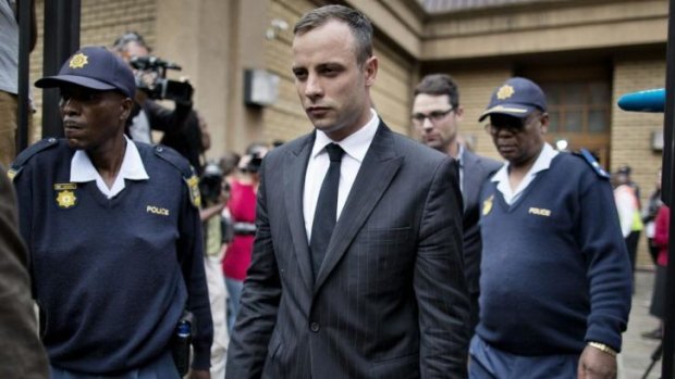 Oscar Pistorius (centre) leaves the North Gauteng High Court in Pretoria. The court has adjourned until May 5.