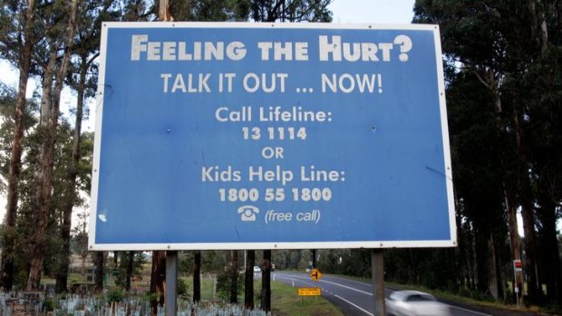A Lifeline board at Kinglake spreads the help message.