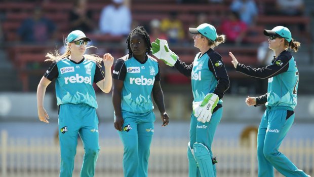 All-rounder: Dottin celebrates after taking the wicket of Sara McGlashan.