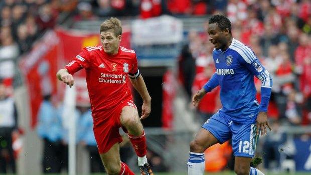 Chelsea's Nigerian midfielder John Obi Mikel  vies with Liverpool's English midfielder Steven Gerrard during the FA Cup final.