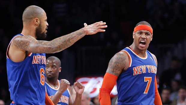 New York Knicks forward Carmelo Anthony (7) and teammate, centre Tyson Chandler (6), after Anthony scored a three-pointer.