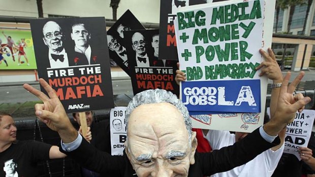 Demonstrators vent their anger against the Murdochs outside Fox Studios during the annual News Corp shareholder meeting in Los Angeles.