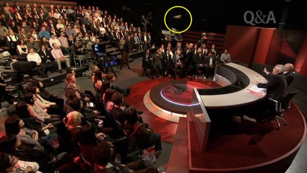 A screengrab of the shoe (circled) being thrown at former prime minister John Howard on <i>Q&A</i> last year.