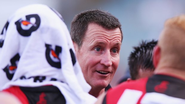 PERTH, AUSTRALIA - MARCH 13: Bombers head coach John Worsfold speaks to his players during the NAB Challenge AFL match between the West Coast Eagles and the Essendon Bombers at Domain Stadium on March 13, 2016 in Perth, Australia.  (Photo by Michael Dodge/Getty Images)