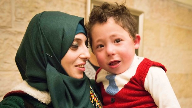 A Palestinian mother with her child being treated at an Israeli hospital through Project Rozana.