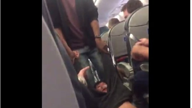 A fellow United passenger's video showed the man being dragged through the aisle.