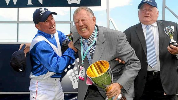High stakes: John Singleton celebrates with jockey Jim Cassidy (L) and trainer Clarry Conners (R) after Dear Demi won the Crown Oaks last year.