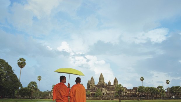 Monks admire Cambodia's famed  Angkor Wat.