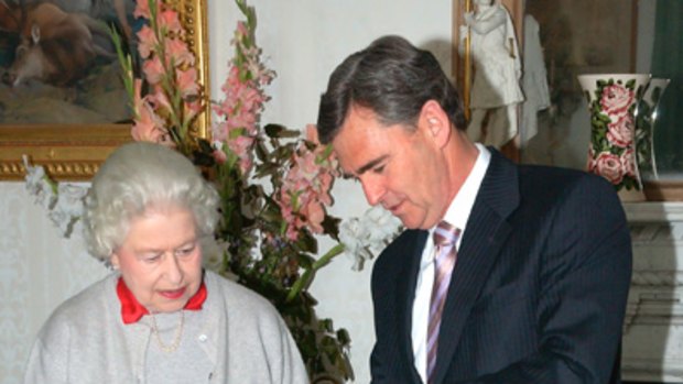 For you .. The Queen accepts a gift from John Brumby.