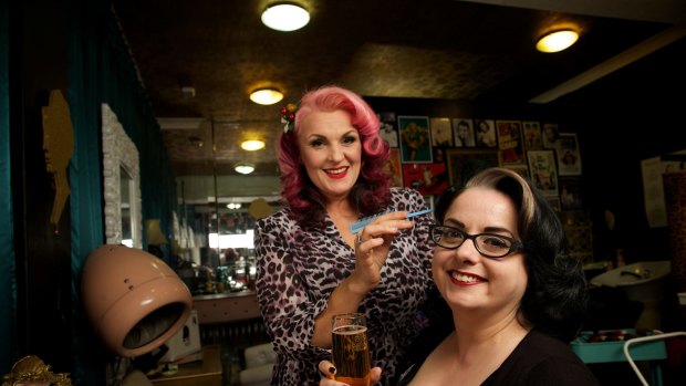 Rockabilly girls: Melina Mel Kesic (left) and Dame Claire Bowdler getting ready for the fifties fair at the Leopard Lounge hair salon, Newtown.