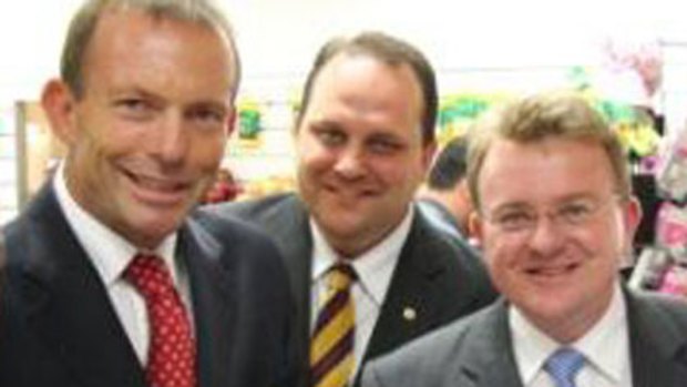 In the wings to offer a hand ... Scott Driscoll, centre, with Tony Abbott, left, and Bruce Billson, right.