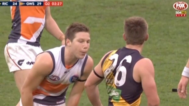 Toby Greene appears to spit at Anthony Miles.