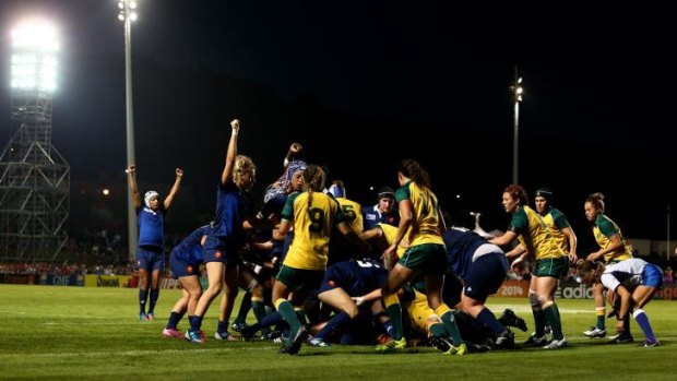 Bleus murder: France celebrate after Gaelle Mignot scores a try against the Wallaroos.