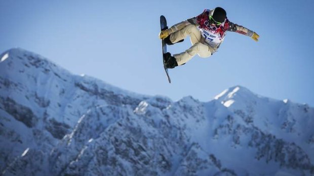 Too risky: US snowboarder Shaun White goes off a jump during slopestyle training at the 2014 Sochi Winter Olympics in Rosa Khutor.