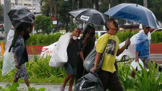 Residents of Manila take precautions against  Typhoon Karika.