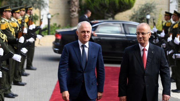 Malcolm Turnbull is escorted through the West Bank by Palestinian Prime Minister Rami Hamdallah on Wednesday. Turnbull said he doesn't support a citizenship audit.