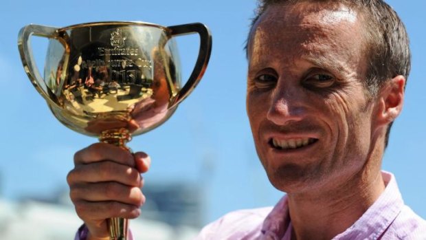 Flashback: Damien Oliver with the 2013 Melbourne Cup which he won on Fiorente.