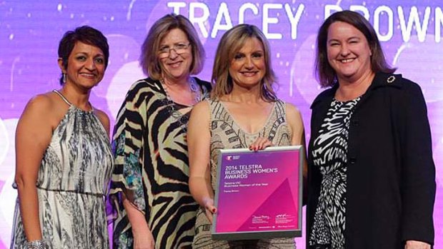 Dr Tracey Brown (second right) with her Businesswoman of the year award.