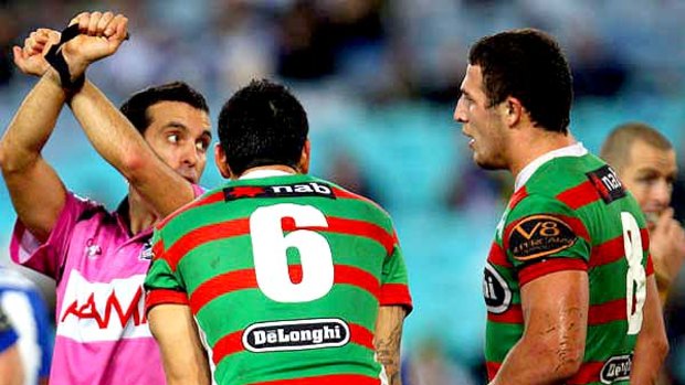 Referee Matt Cecchin places Sam Burgess on report during the match against the Bulldogs.