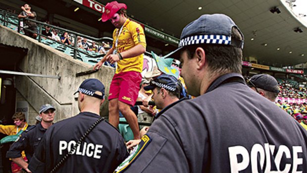 You can’t do that here ... police evict a group of men for allegedly smuggling alcohol into the SCG during the Second Test against Pakistan.