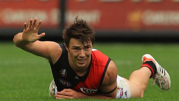 Michael Hibberd on the ground after sustaining a hamstring injury.
