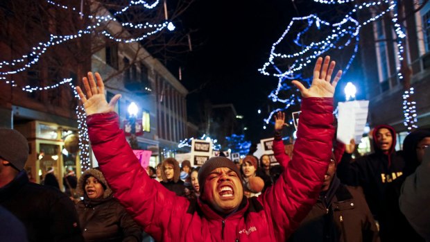 Demonstrators chant during a protest in Michigan.