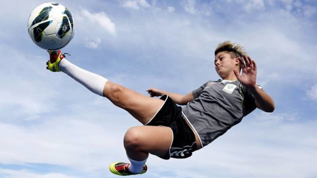 Michelle Heyman shows off her acrobatic skills before Canberra United training last night.