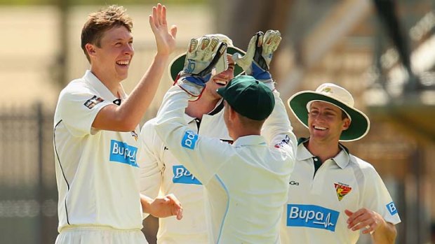 Simon Mackin celebrates the wicket of Ian Bell whilst bowling for the Chairman's XI.