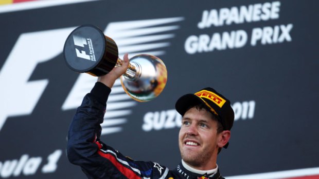 No.1: Sebastian Vettel celebrates his title coup.