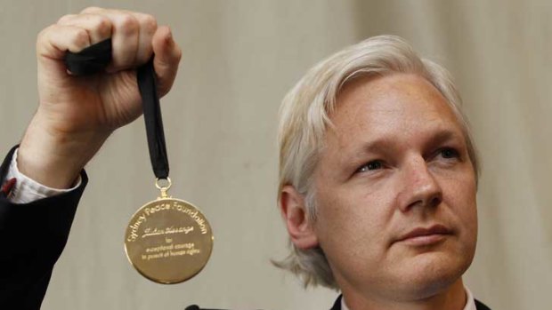 Julian Assange with the Sydney Peace Prize he received this month.