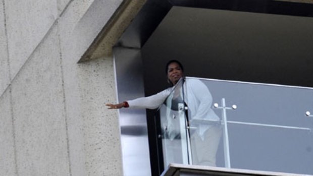 Relaxing afternoon ... Oprah Winfrey at the Intercontinental hotel yesterday, the temporary home for her entourage of hundreds.