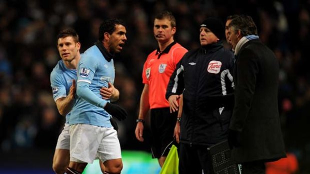 Carlos Tevez has words with Manchester City manager Roberto Mancini after being substituted against Bolton Wanderers earlier this month.