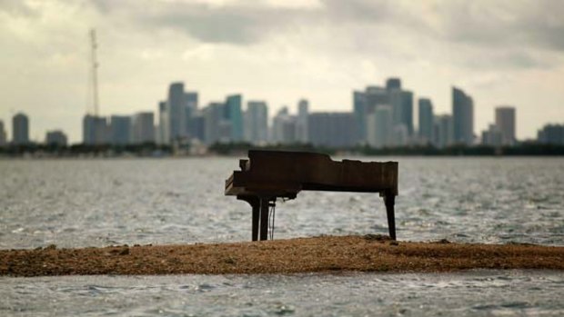 What's the score? ... In the middle of Biscayne Bay, with the Miami skyline for a backdrop, a piano sat on a sandbar, confounding residents and police.