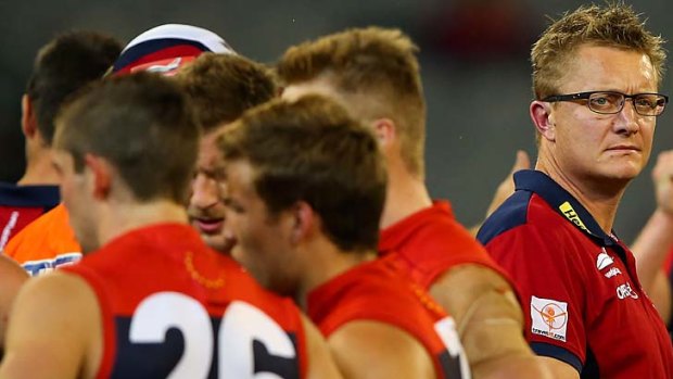 Under siege: Melbourne coach Mark Neeld lets the players do the talking during the Demons' huge loss to Gold Coast at the MCG on Sunday.