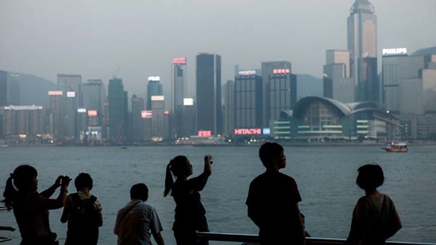 Choking ... authorities in Hong Kong issued health warnings as pollution index in the city hit its worst levels in more than two years.