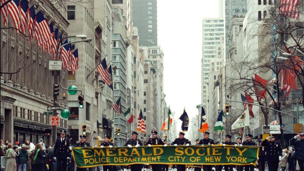 New York City Police Department's Emerald Society marches up Fifth Avenue.
